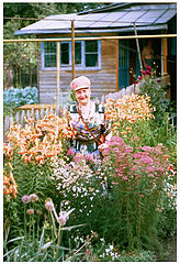 photo "My Grandmother in the middle of blossoming plants."