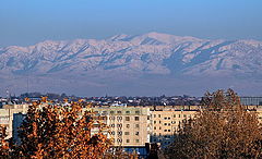 photo "Mountains above а city"