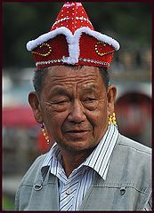 фото "Portrait-39-An elderly with princess hat"