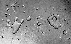 photo "Drops of water on a steel table"