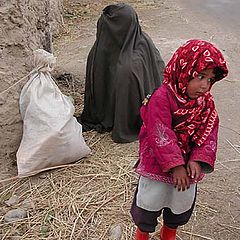 photo "Refugee girl with mother"