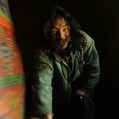 фото "Blind man turning prayer wheel"