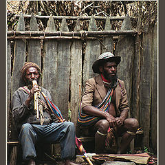 photo "Papuans resting on the bench..."