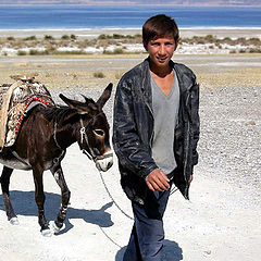 photo "As the young man offered to sweep on a donkey"