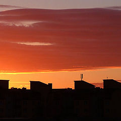 фото "Black roofs on a background of the red sky"