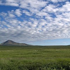 photo "Simple tundra landscape with sky and alone mountain"