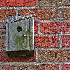 photo "Old small house on a wall"