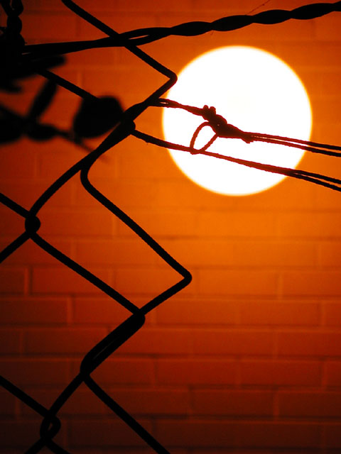 photo "Artificial sun behind a prisoner`s fence" tags: abstract, architecture, landscape, 