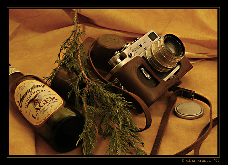 photo "A chance meeting of a camera and a beer bottle on" tags: still life, 