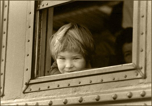 photo "That Day: Looking out window of train" tags: reporting, portrait, children