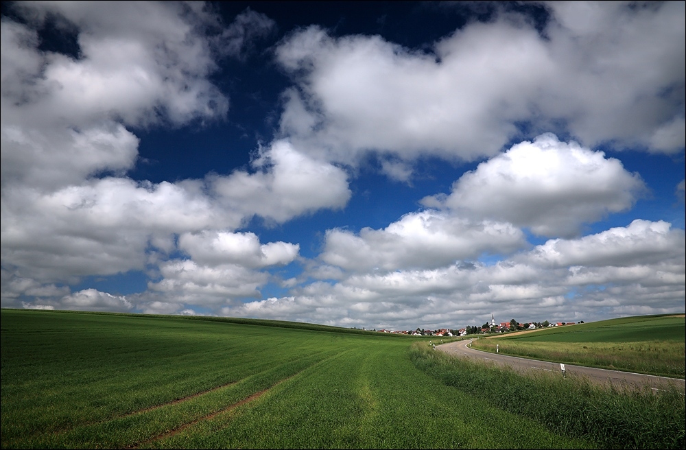 photo "A town under blue sky" tags: landscape, clouds