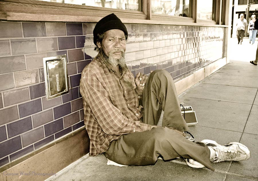 photo "down but not out." tags: portrait, reporting, man