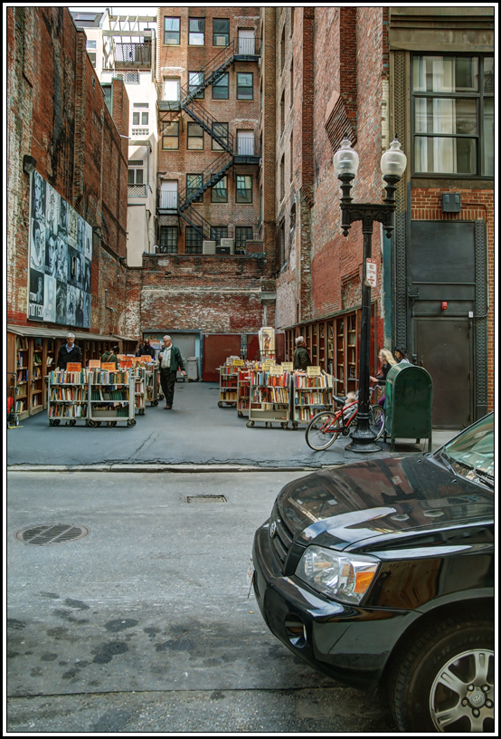 photo "At a second-hand bookstore" tags: city, genre, 